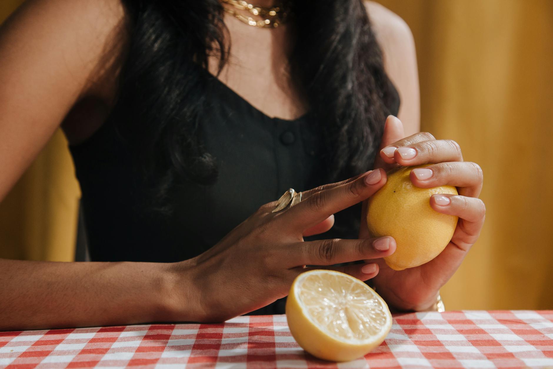 Bright ripe lemons arranged on a soft pastel background