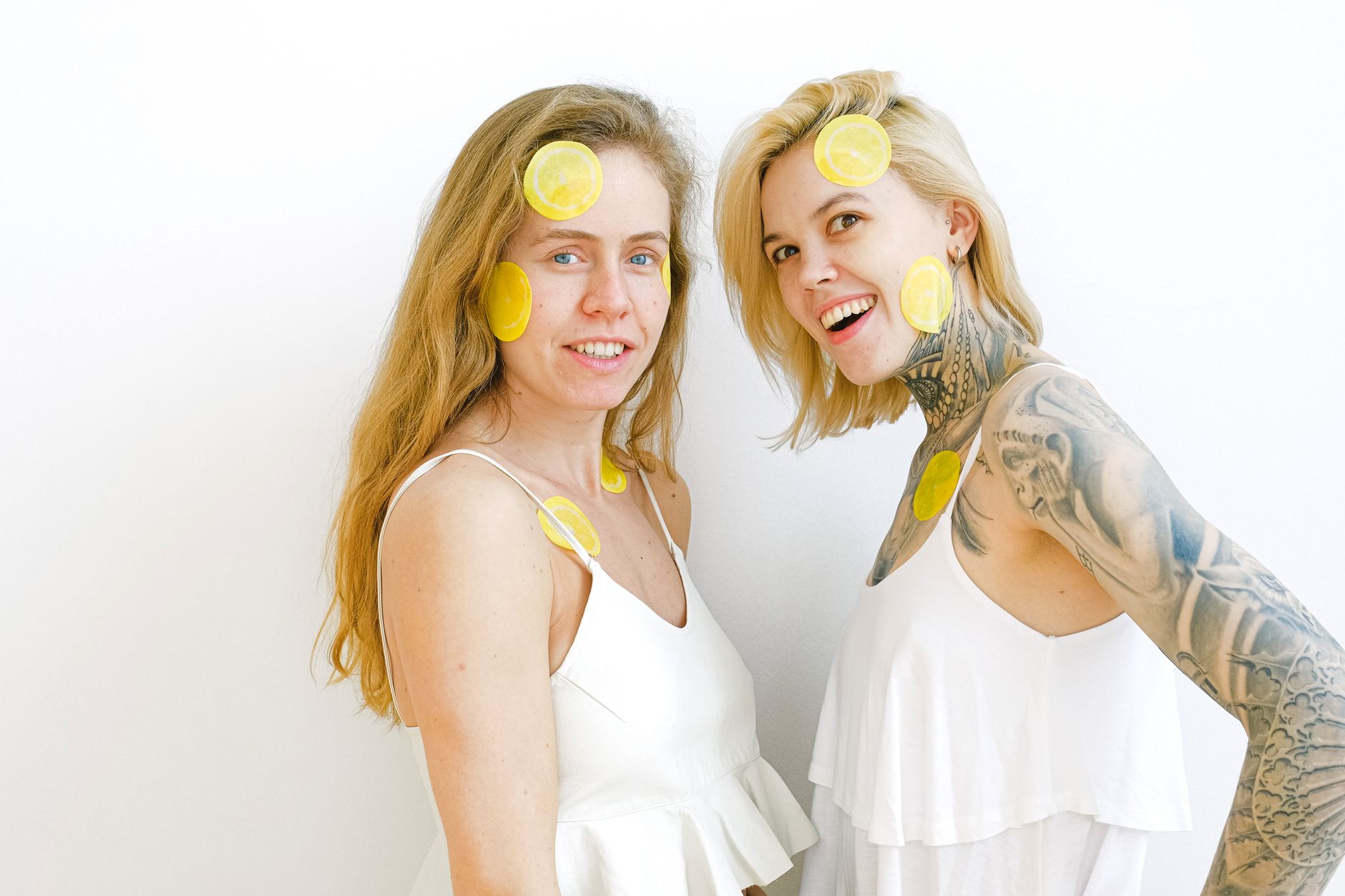 Two women smiling and laughing together, representing joy and emotional connection